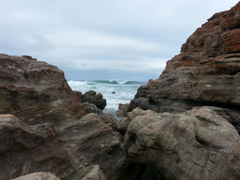 Scenic view of sea against cloudy sky