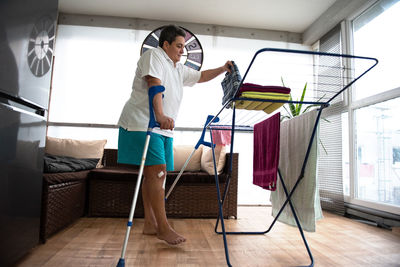 A disabled person washes laundry.