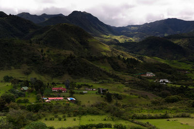 High angle view of townscape and mountains against sky