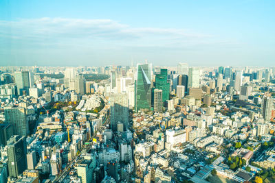 High angle view of modern buildings in city against sky