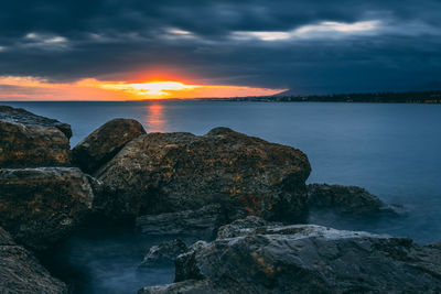 Scenic view of sea against sky during sunset