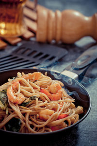 Close-up of meat in cooking pan on table