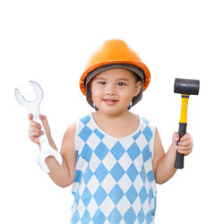 Mid adult man holding camera against white background