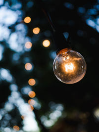 Low angle view of illuminated light bulb