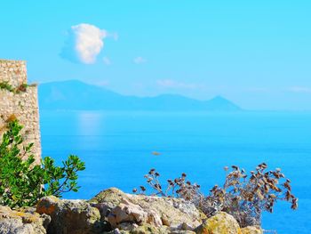 Scenic view of sea against blue sky