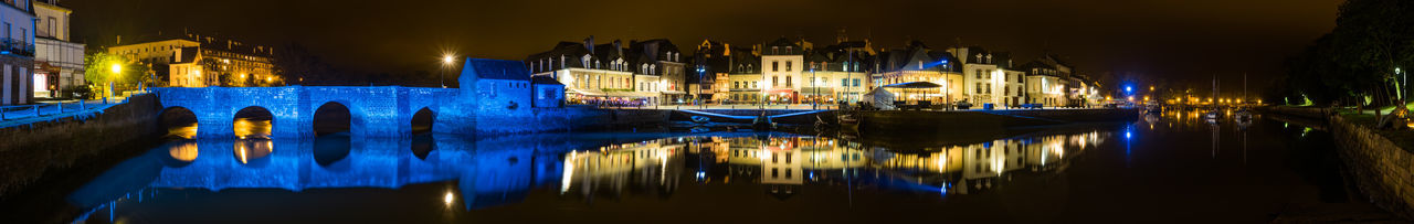 Reflection of illuminated buildings in water at night