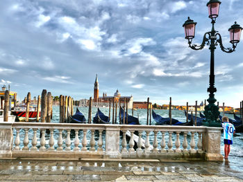 View of buildings against cloudy sky