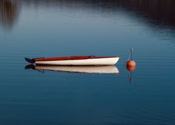 Boat moored in lake