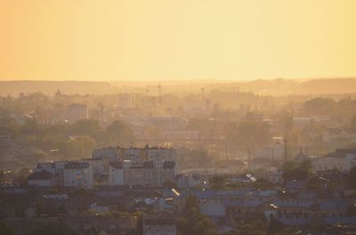 High angle view of buildings in city against clear sky