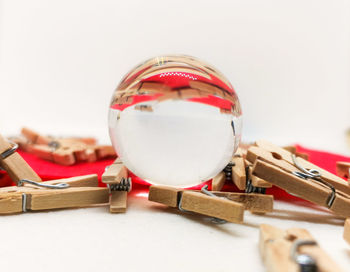 Close-up of toy on table against white background