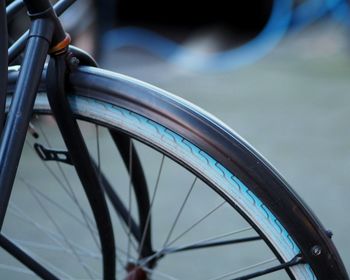 Close-up of bicycle wheel against sky