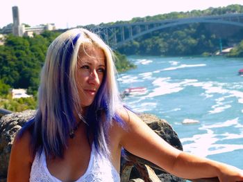 Woman with long hair by river