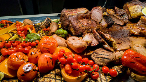 High angle view of fruits and vegetables on barbecue