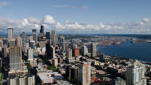 High angle view of cityscape against sea