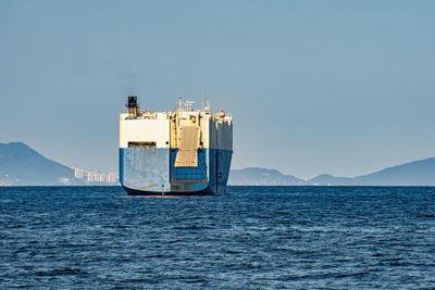 Ship in sea against clear sky