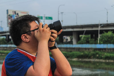 Midsection of man using mobile phone