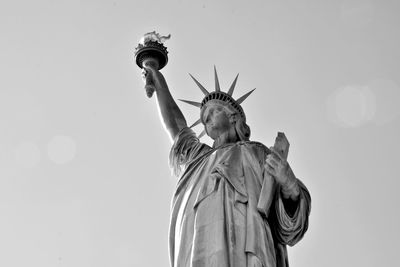 Low angle view of statue against sky