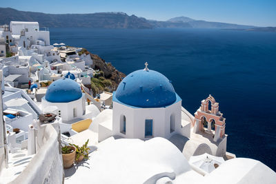 Panoramic view of buildings against sea