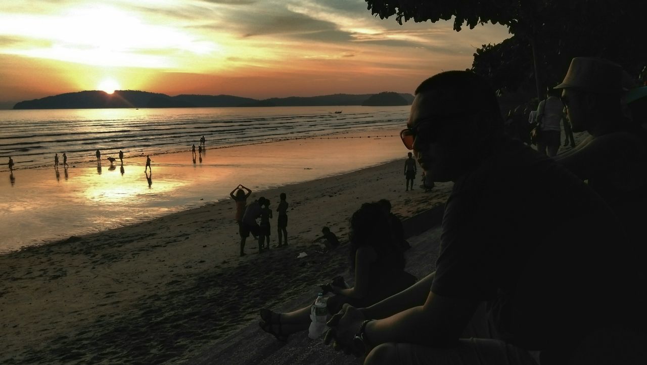 sunset, sea, beach, water, shore, sky, silhouette, horizon over water, leisure activity, lifestyles, men, sun, scenics, sand, beauty in nature, person, tranquil scene, nature, tranquility