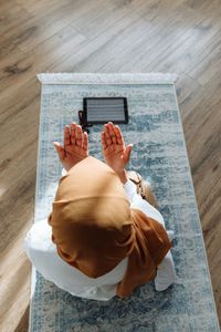 High angle view of woman with islamic theme in ramadan kareem