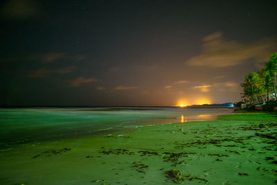 Scenic view of sea against sky at night