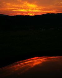 Scenic view of dramatic sky at sunset