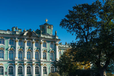 Low angle view of building against blue sky