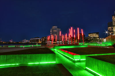 Illuminated buildings in city at night