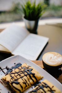 Close-up of coffee served on table