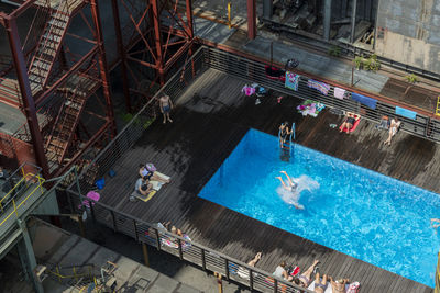 High angle view of people at swimming pool