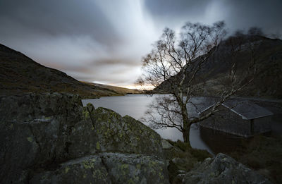 Scenic view of lake against sky during winter