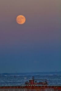 Scenic view of sea against sky at evening