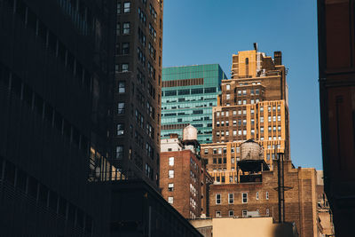 Low angle view of buildings against clear sky