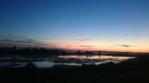 Scenic view of sea at sunset