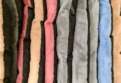 Samples of cloth and fabrics in different colors found at a fabrics market.