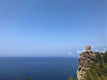 Scenic view of sea against clear blue sky