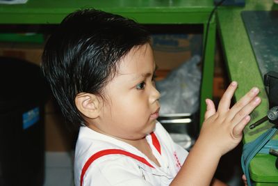 Close-up of cute baby boy at school