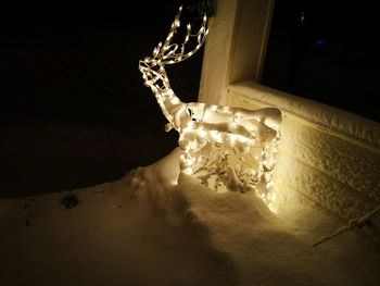 Low angle view of illuminated christmas lights at home