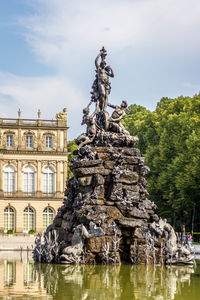 Statue of historic building against sky