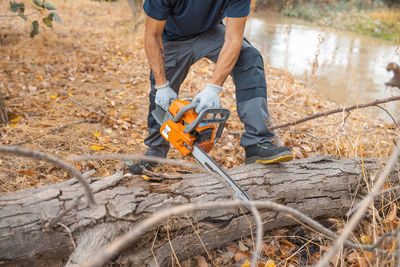 Low section of man working on field