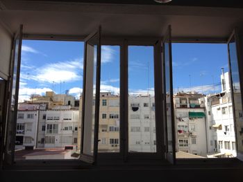 View of buildings against blue sky
