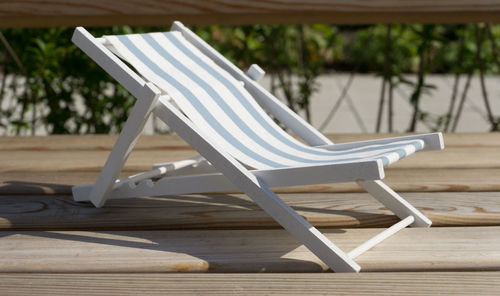 Close-up of empty chair on table