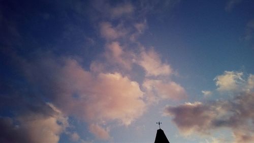 High section of building against cloudy sky