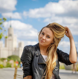 Beautiful young girl in sunglasses walks around the city person