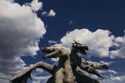 Low angle view of statue against sky