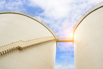 Low angle view of factory against sky