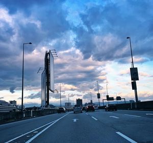 Cars on road against sky