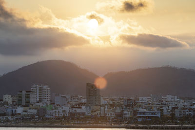 Cityscape against sky during sunset