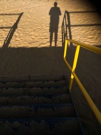 Shadow of people on road