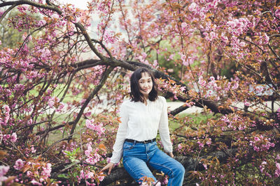 Young asian woman in a white shirt, spring portrait